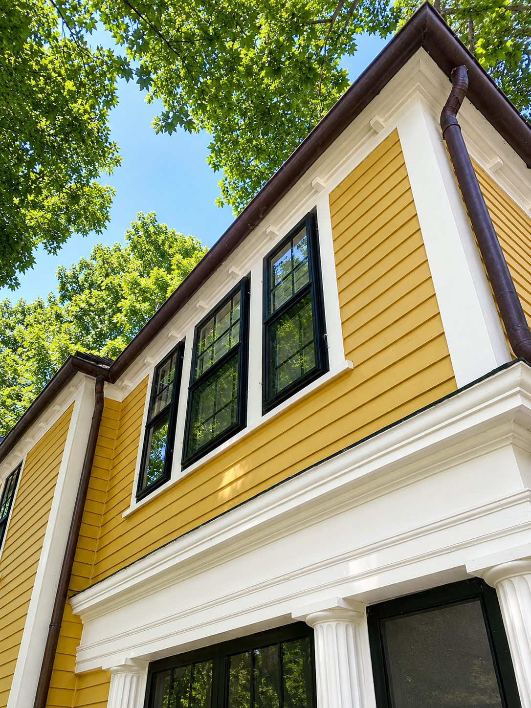Casco aluminum storm windows installed on an existing building exterior
